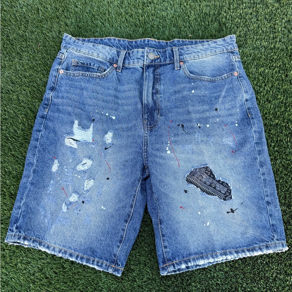 Vintage distressed jorts with paint splatter and sowed on fabric